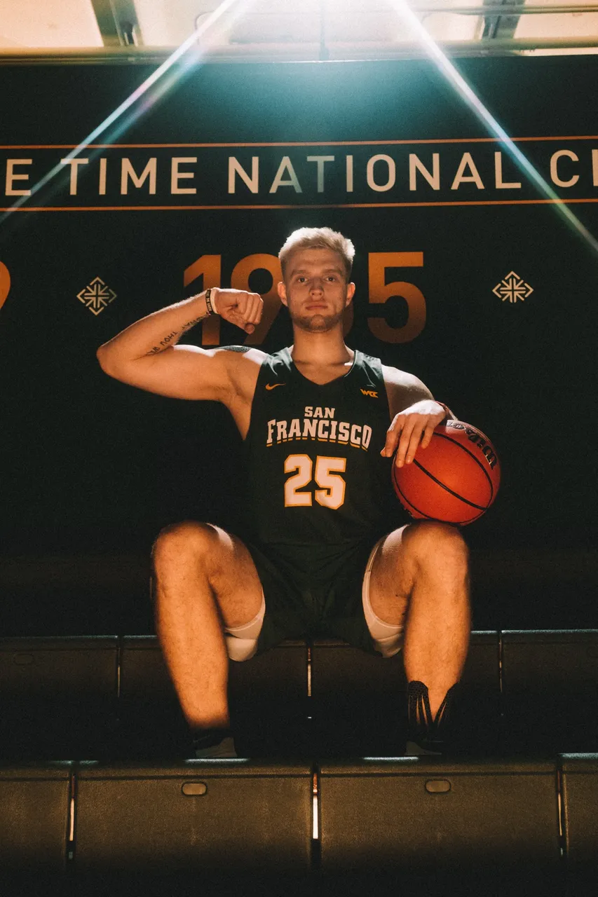 Yauhen Massalski (#25) on the court for the University of San Francisco