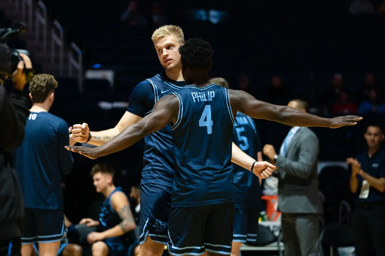 Yauhen Massalski (#25) rising for a block for the University of San Diego against Stanford